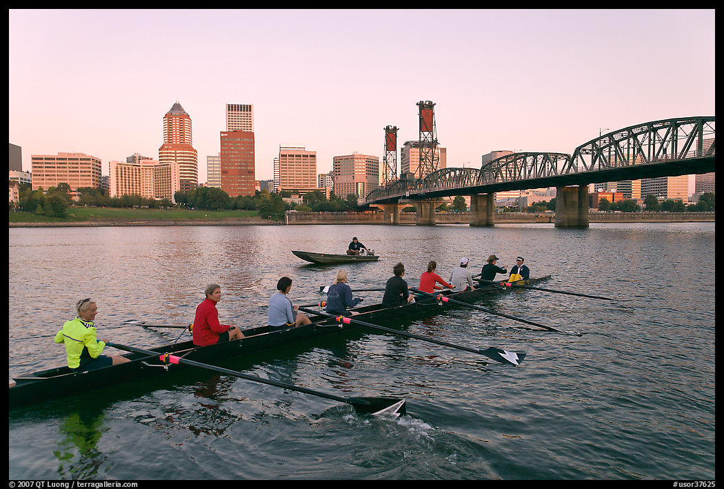 Eight-oar shell and city skyline at sunrise. Portland, Oregon, USA