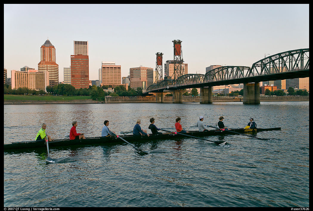 Eight-oar shell on Williamette River and city skyline. Portland, Oregon, USA