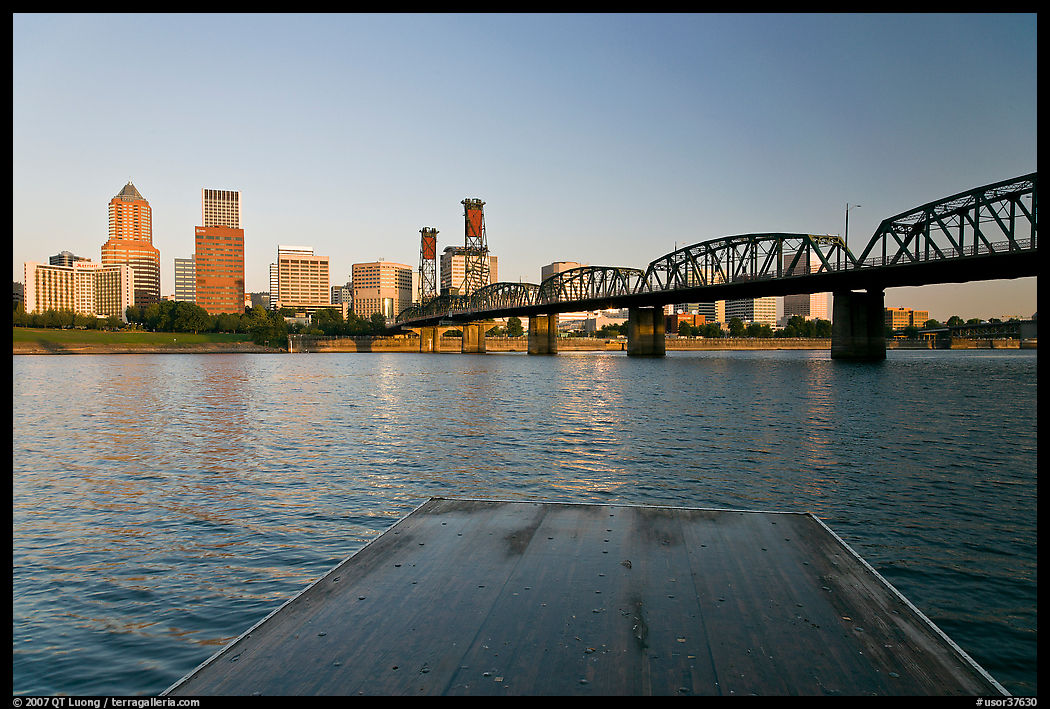 Deck, and Portland skyline with bridge at sunrise. Portland, Oregon, USA