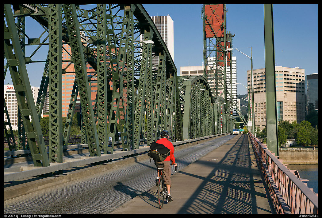 Bicyclist on Hawthorne Bridge. Portland, Oregon, USA