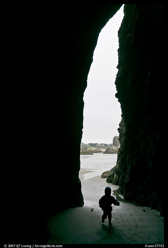 Infant and sea cave opening from inside. Bandon, Oregon, USA