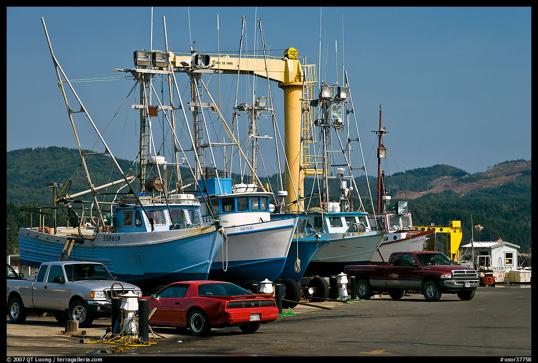 Fishing boats and cars parked on deck, Port Orford. Oregon, USA