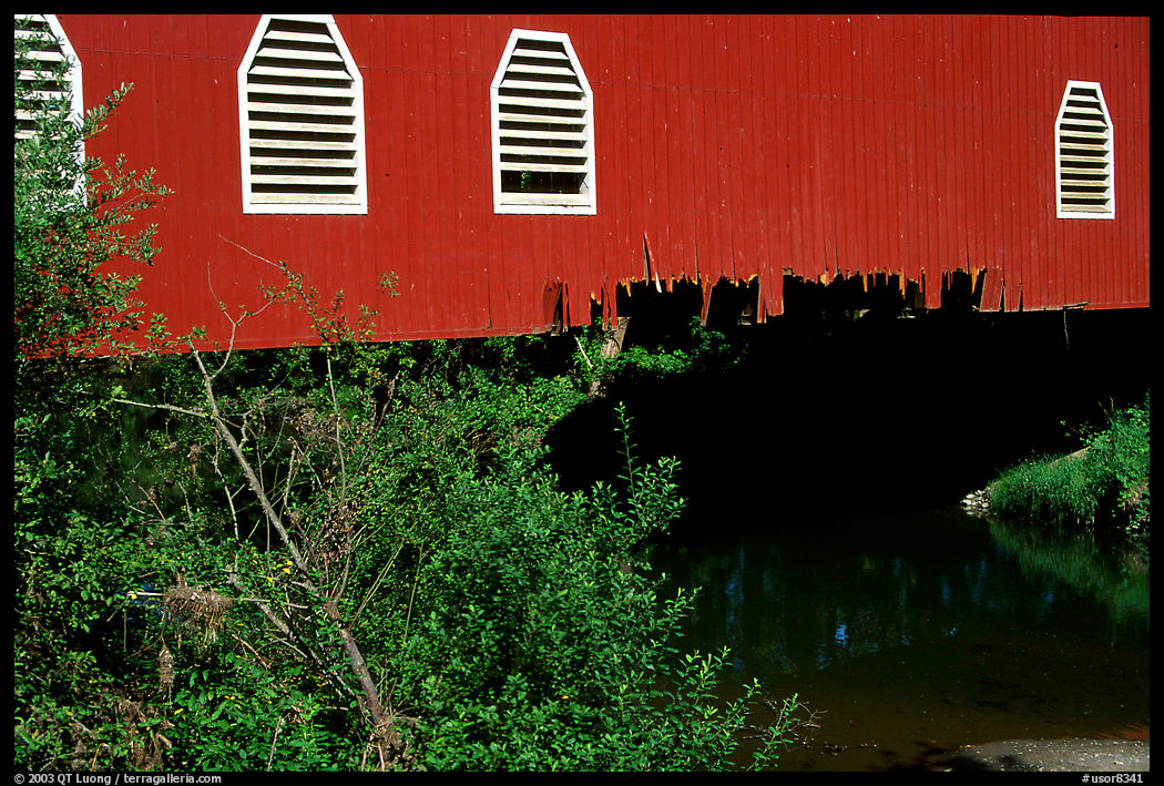 Detail of red covered bridge and river, Willamette Valley. Oregon, USA
