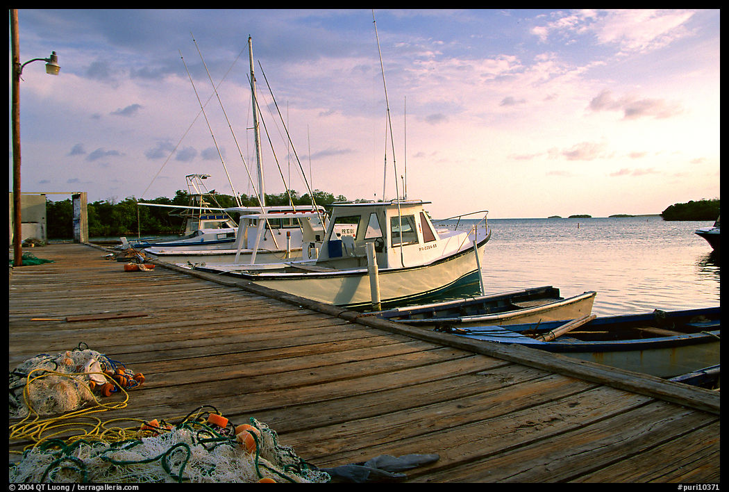 Pier and small boats at sunset, La Parguera. Puerto Rico