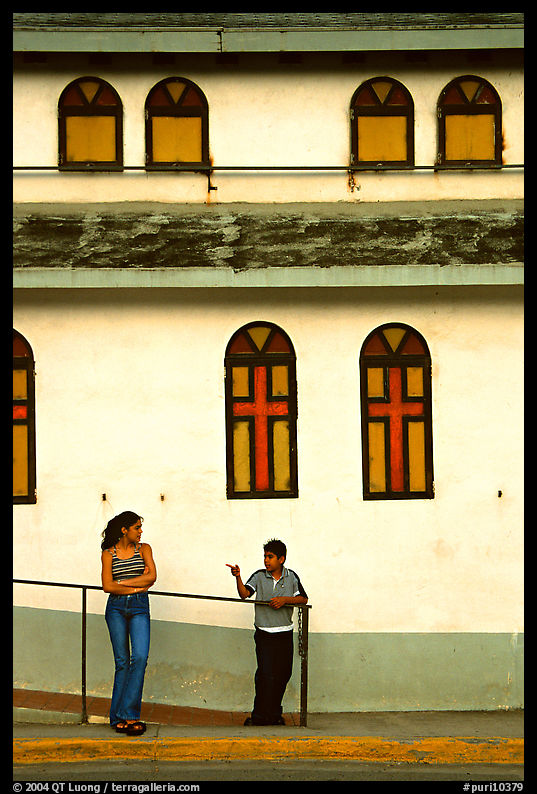 Woman and boy talking besides a church, La Parguera. Puerto Rico