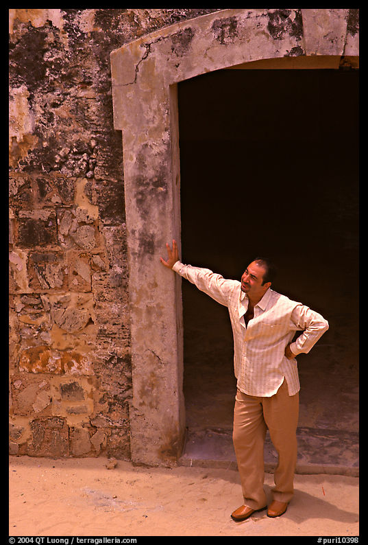 Man standing next to a doorway, El Morro Fortress. San Juan, Puerto Rico