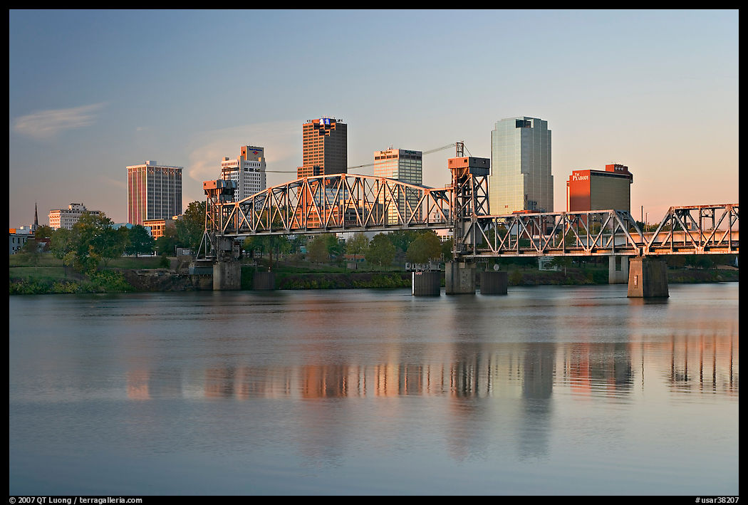 Skyline and bridge with reflections in river at sunrise. Little Rock, Arkansas, USA