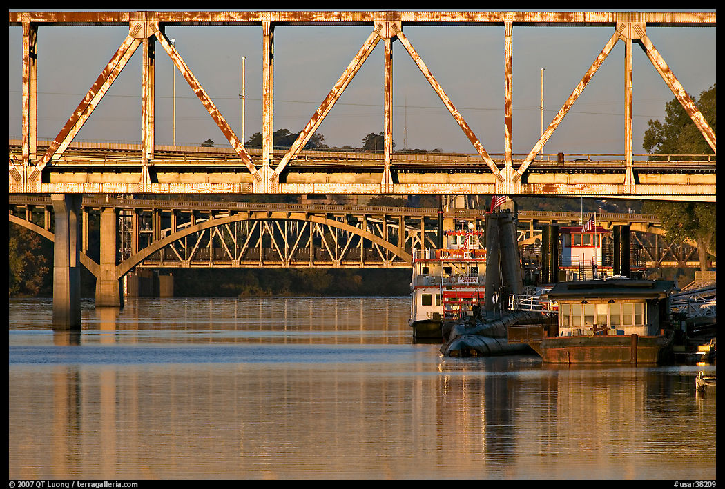 Bridges over Arkansas River, submarine and riverboats at sunrise. Little Rock, Arkansas, USA