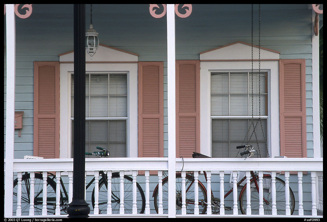 Bicycle on pastel-colored porch. Key West, Florida, USA