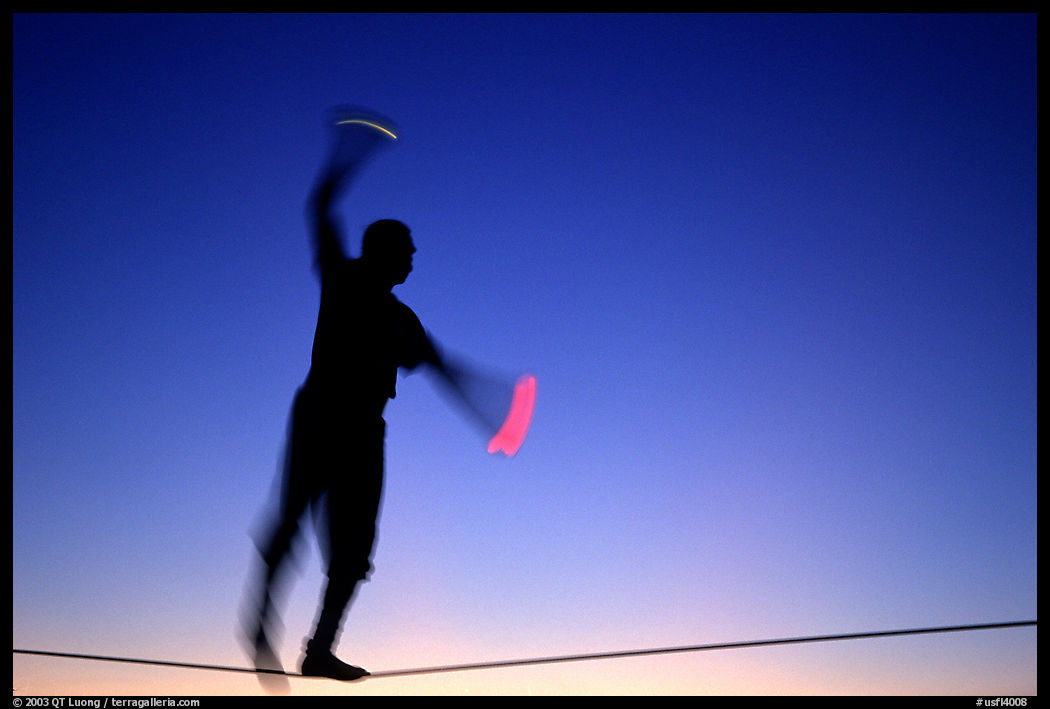 Equilibrist on Mallory Square at sunset. Key West, Florida, USA