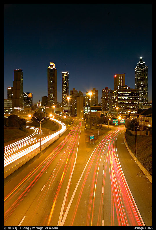Highway and Atlanta skyline at night. Atlanta, Georgia, USA
