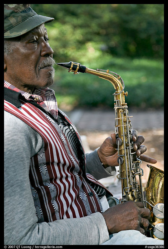 African-American musician with saxophone in square. Savannah, Georgia, USA
