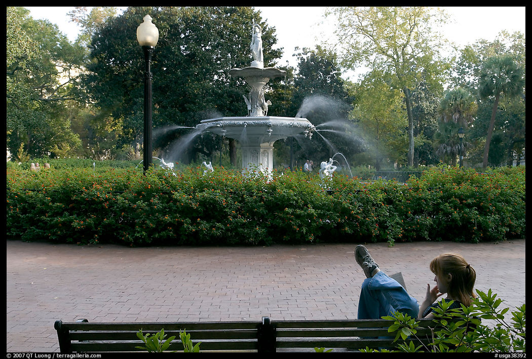 Woman reading in front of Forsyth Park Fountain. Savannah, Georgia, USA