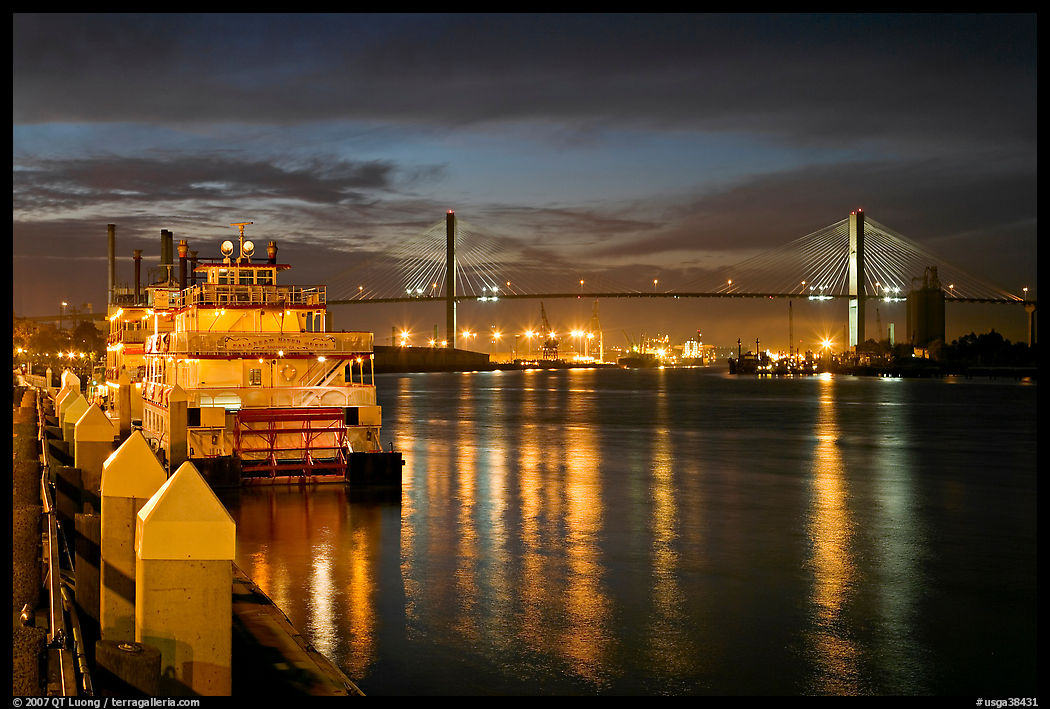 Riverboat and Savannah Bridge at dusk. Savannah, Georgia, USA