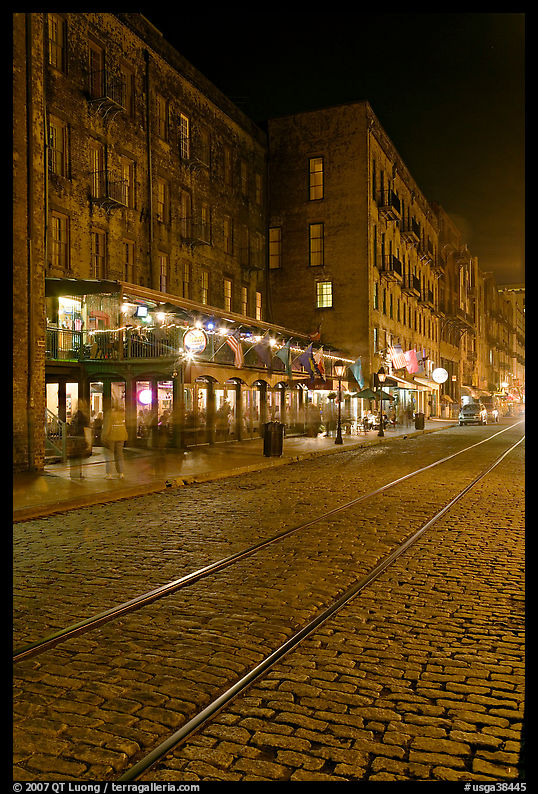 Brick and cobblestone waterside street by night. Savannah, Georgia, USA