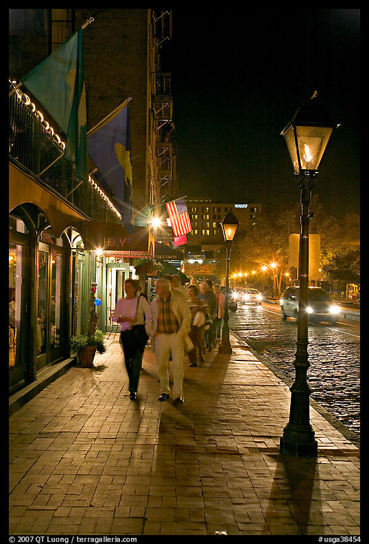 People on sidewalk of River Street by night. Savannah, Georgia, USA
