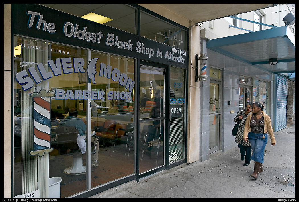 Women walking in front of oldest black shop in Atlanta. Atlanta, Georgia, USA
