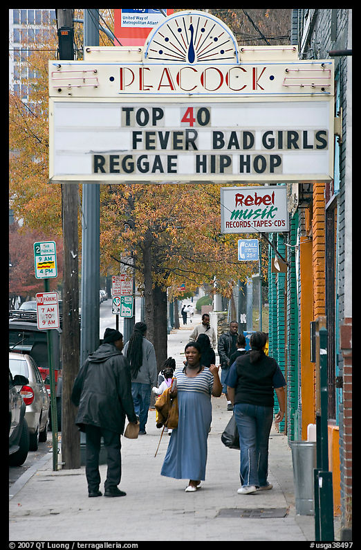 African American people on sidewalk in front of Peackok music store. Atlanta, Georgia, USA