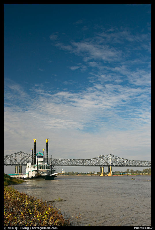Mississippi River, paddle riverboat, and bridge. Natchez, Mississippi, USA