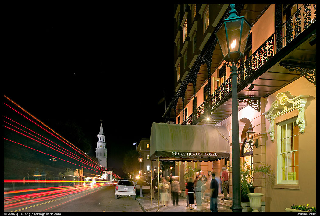 Street, church, and Mills house hotel with many guests at night. Charleston, South Carolina, USA