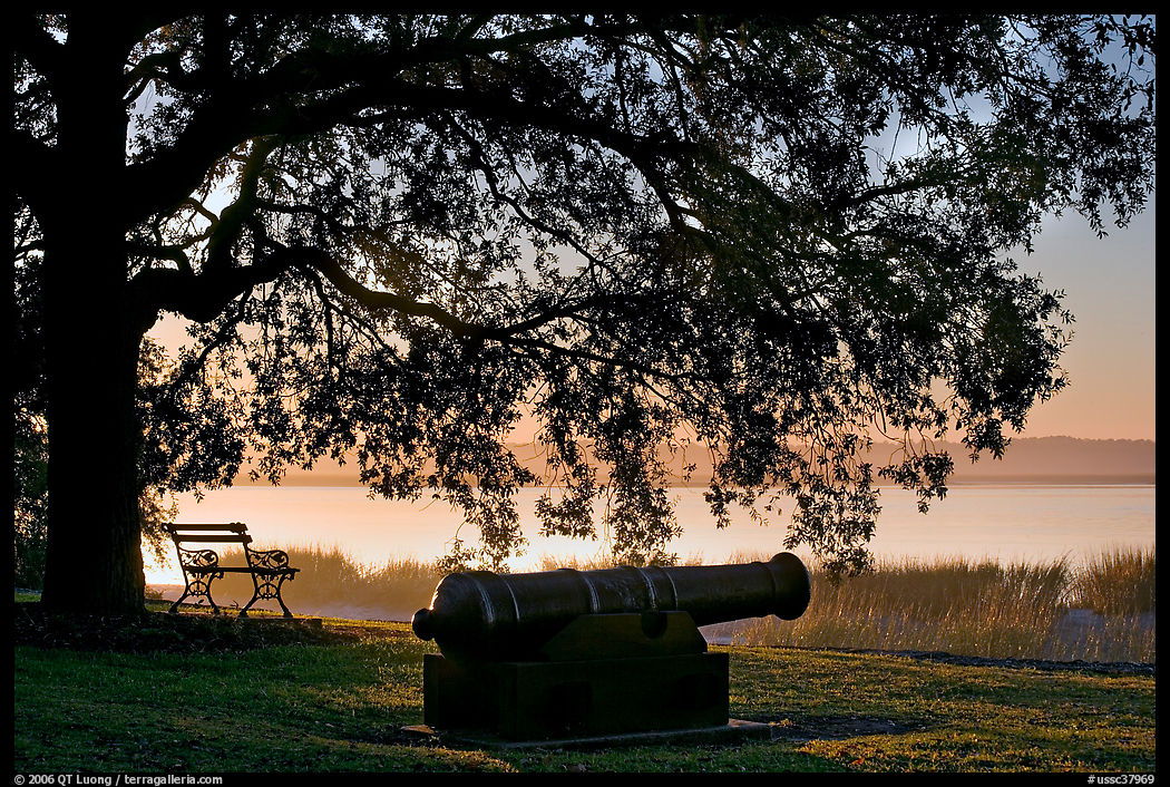 Cannon, and bench overlooking Beaufort Bay at sunrise. Beaufort, South Carolina, USA