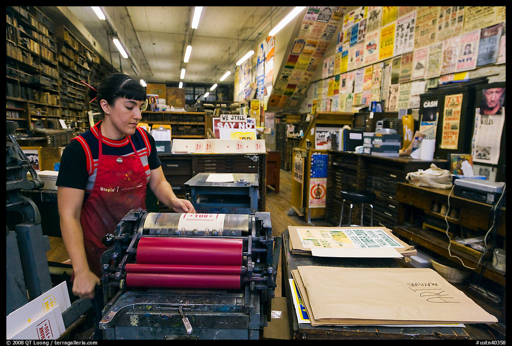 Woman printing poster at Hatch Show print. Nashville, Tennessee, USA