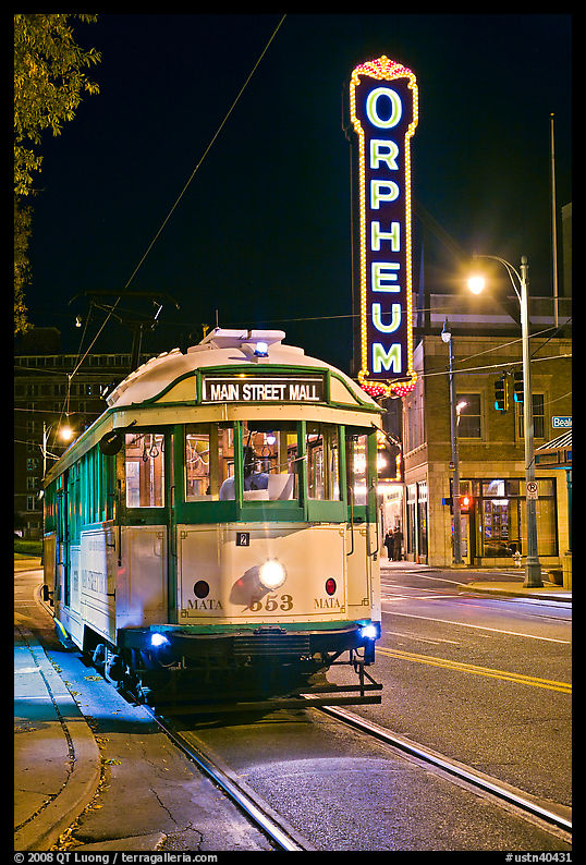 Trolley and Orpheum theater sign by night. Memphis, Tennessee, USA