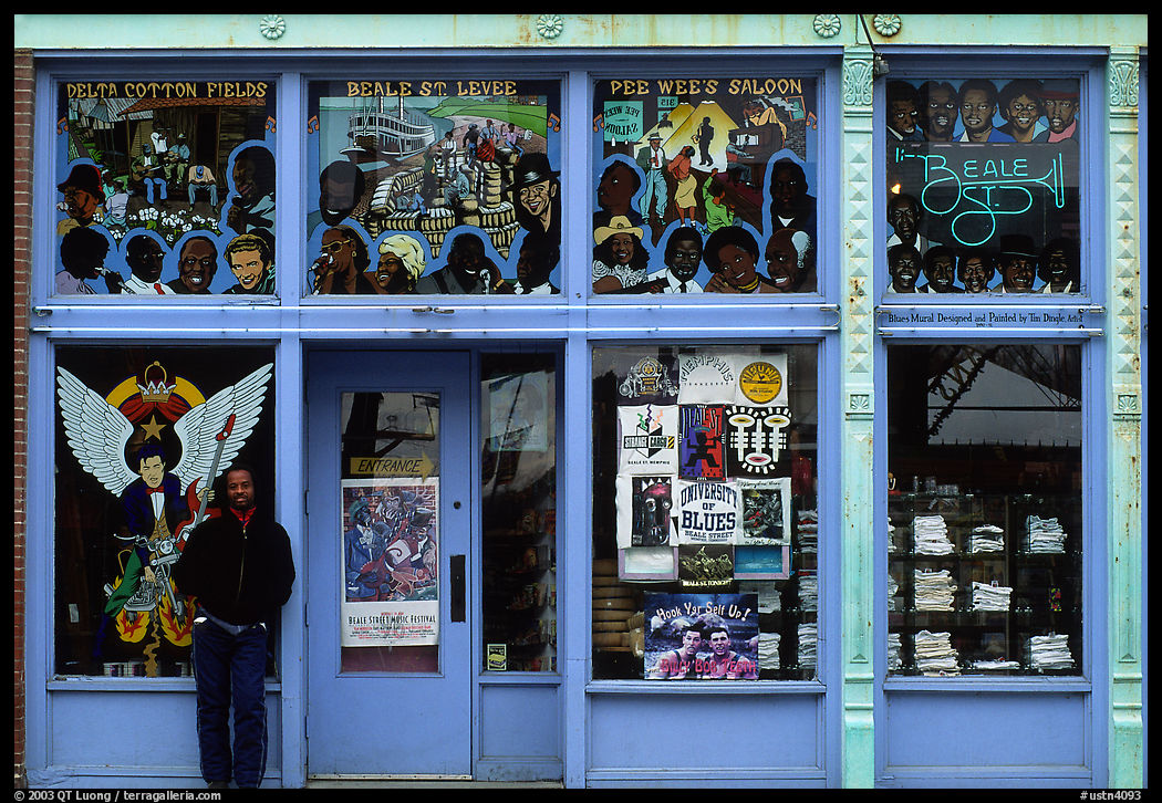 African-American man standing in front of blue storefront on Beal street. Memphis, Tennessee, USA