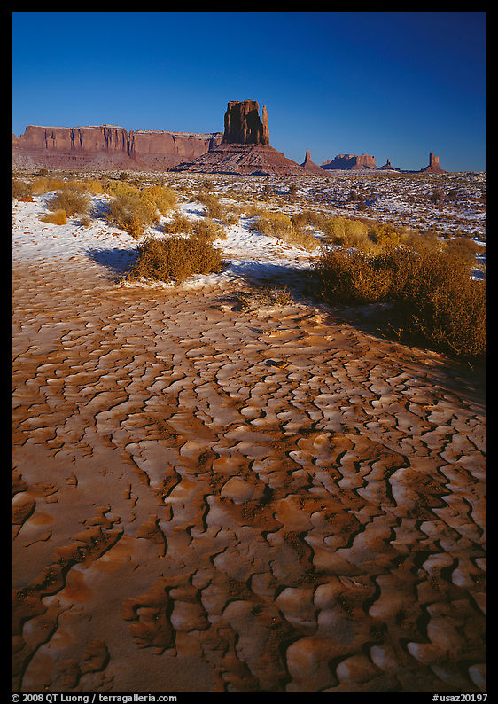 Clay pattern on floor and buttes in winter. Monument Valley Tribal Park, Navajo Nation, Arizona and Utah, USA