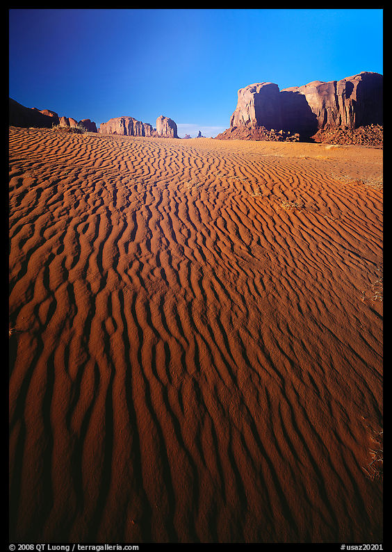 Ripples on sand dunes and mesas, late afternoon. Monument Valley Tribal Park, Navajo Nation, Arizona and Utah, USA