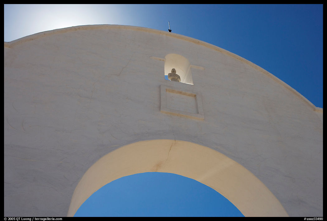Backlit whitewashed arch, San Xavier del Bac Mission. Tucson, Arizona, USA