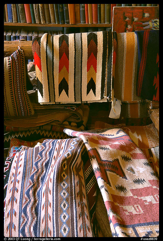 Stacks of varicolored blankets and rugs weaved by Navajo Indians. Hubbell Trading Post National Historical Site, Arizona, USA