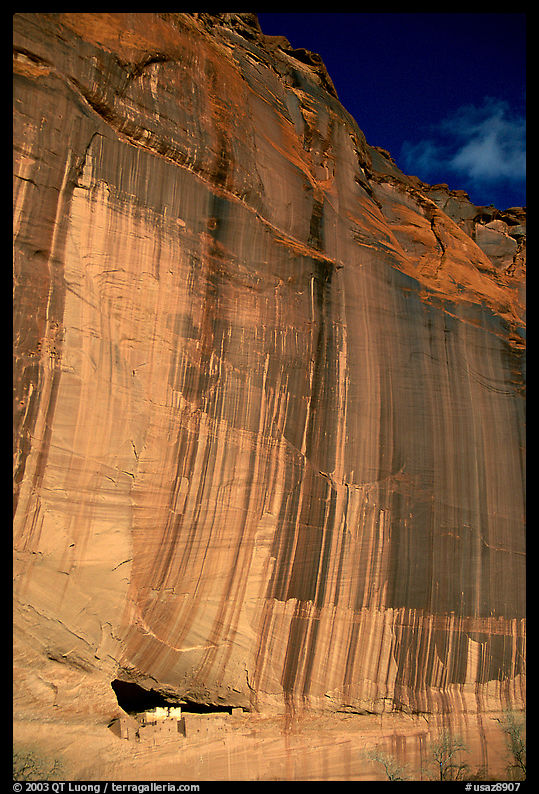 White House Ancestral Pueblan ruins and wall with desert varnish and corner of sky. Canyon de Chelly  National Monument, Arizona, USA