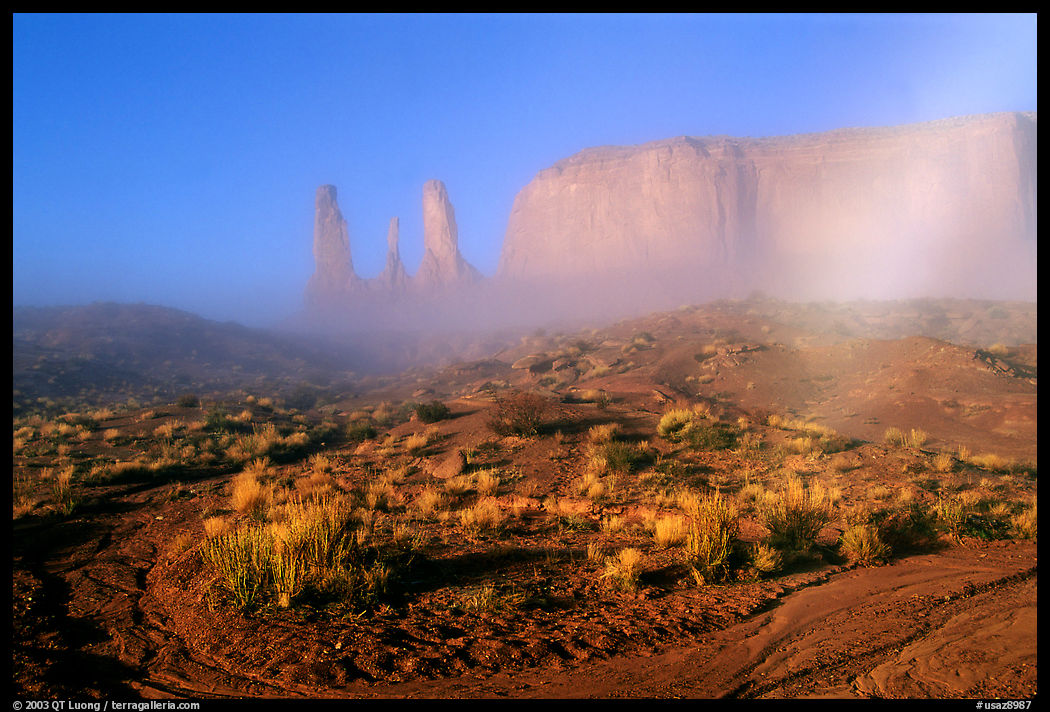 Three sisters, clearing fog, morning. Monument Valley Tribal Park, Navajo Nation, Arizona and Utah, USA