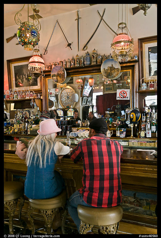 Man and woman sitting in saloon. Virginia City, Nevada, USA