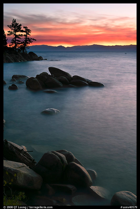 Sunset over lake with boulders, Sand Harbor, East Shore, Lake Tahoe, Nevada. USA