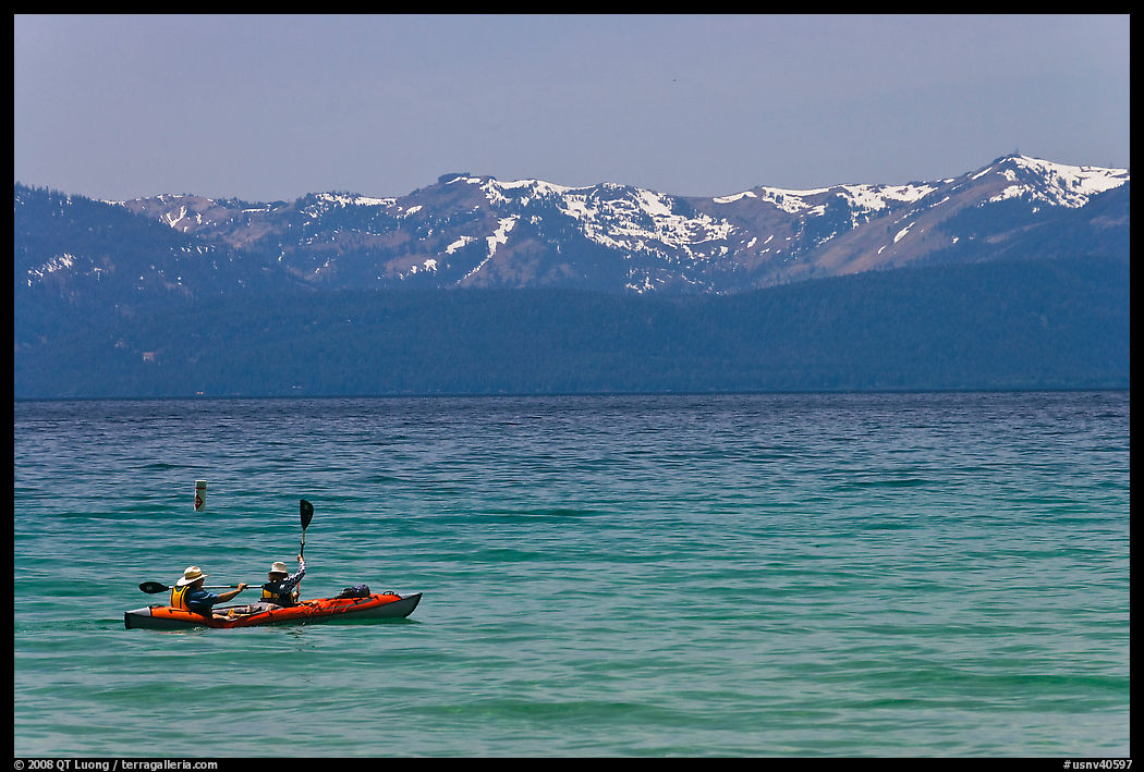 Kayak, turquoise waters and snowy mountains, East Shore, Lake Tahoe, Nevada. USA