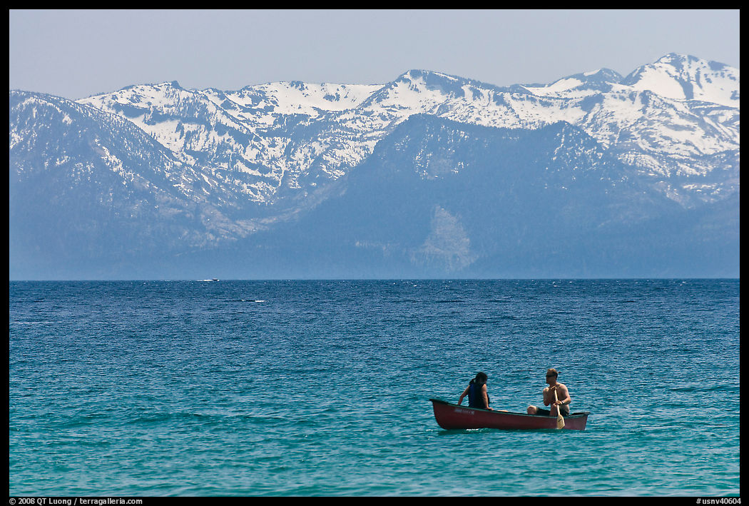 Canoe and snowy mountains, Lake Tahoe, Nevada. USA