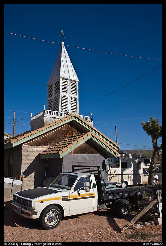 Truck and house with bell-tower, Beatty. Nevada, USA