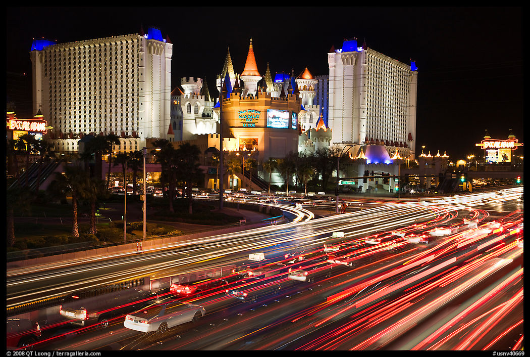 Traffic light trails and Excalibur casino at night. Las Vegas, Nevada, USA