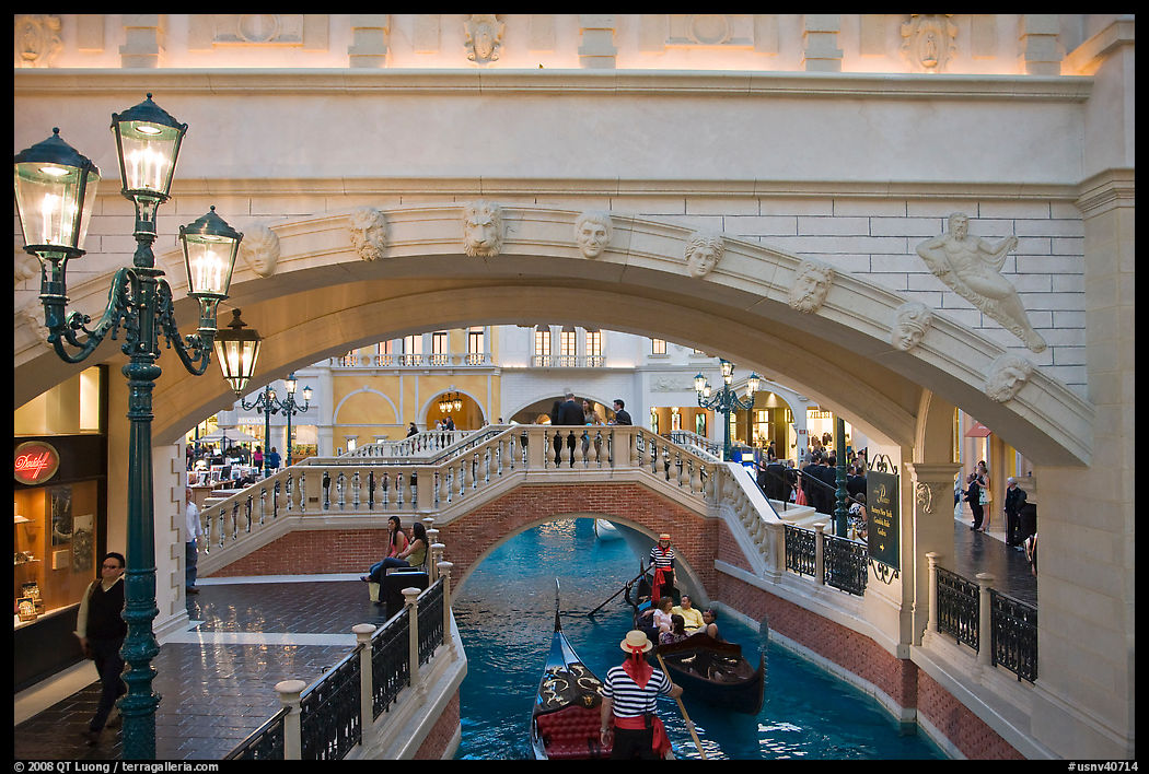 Gondolas passing below bridge, inside Venetian hotel. Las Vegas, Nevada, USA