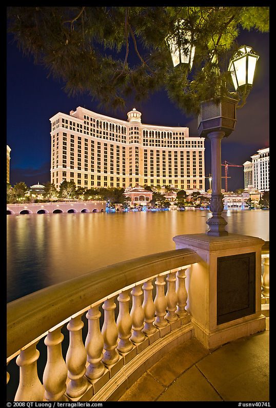 Lamp, reflection lake, and Bellagio hotel at night. Las Vegas, Nevada, USA