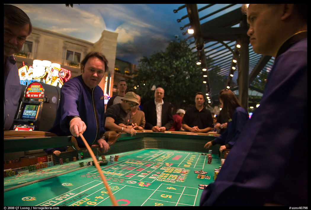Dealer collecting during Craps game. Las Vegas, Nevada, USA