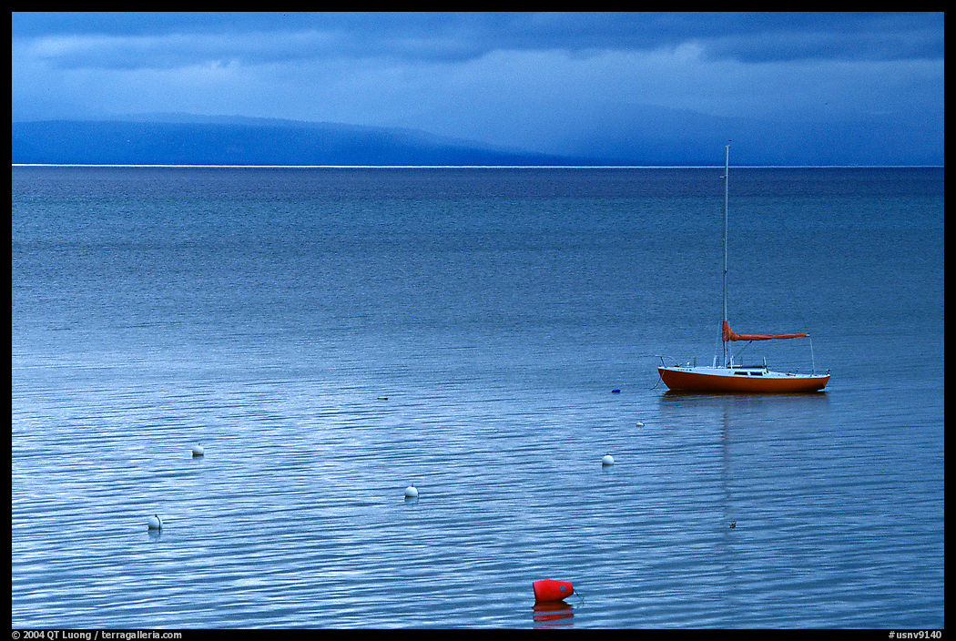 Boat, dusk, Lake Tahoe. California and Nevada, USA