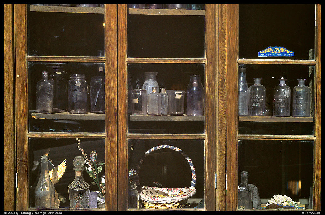 Old bottles in a store window, Austin. Nevada, USA