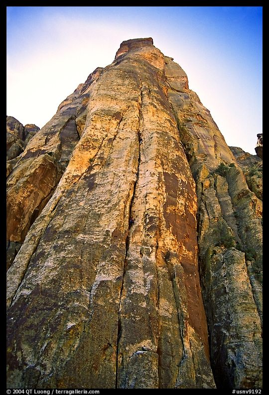 Tall sandstone wall with rock climbers. Red Rock Canyon, Nevada, USA