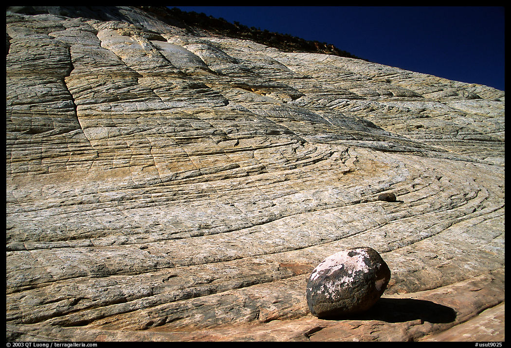 Boulder and striated Sandstone, Burr Trail, Grand Staircase Escalante National Monument. Utah, USA