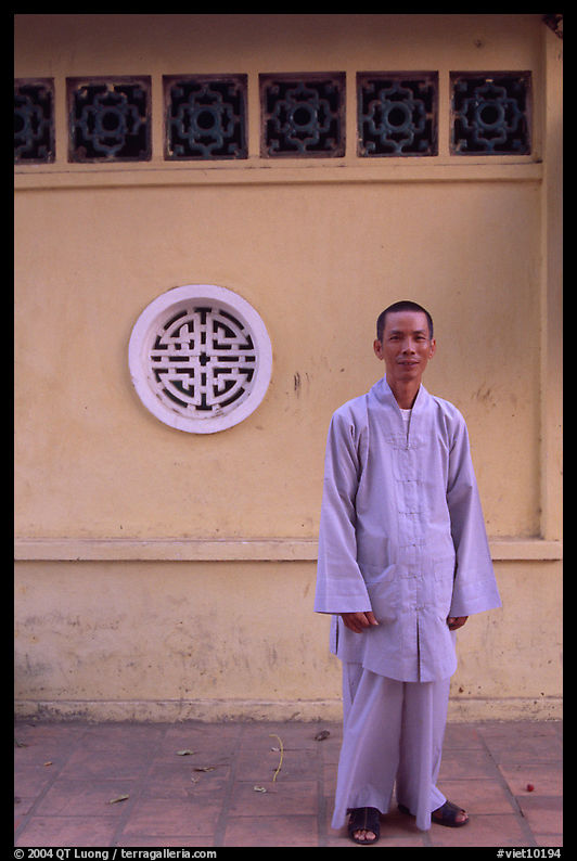 Monk standing outside Giac Vien Pagoda. Ho Chi Minh City, Vietnam