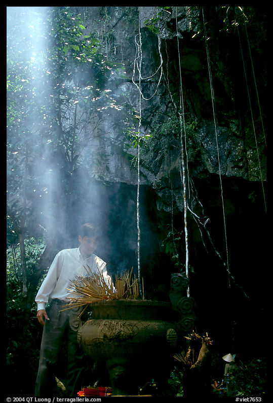 Urn and incense near the entrance of Phong Nha Cave. Vietnam