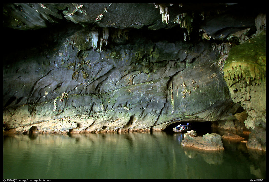 Tour boat getting out of a tunnel, Phong Nha Cave. Vietnam